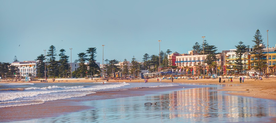 General view of the city beach with holidaymakers on the beach - Essaouira, Morocco