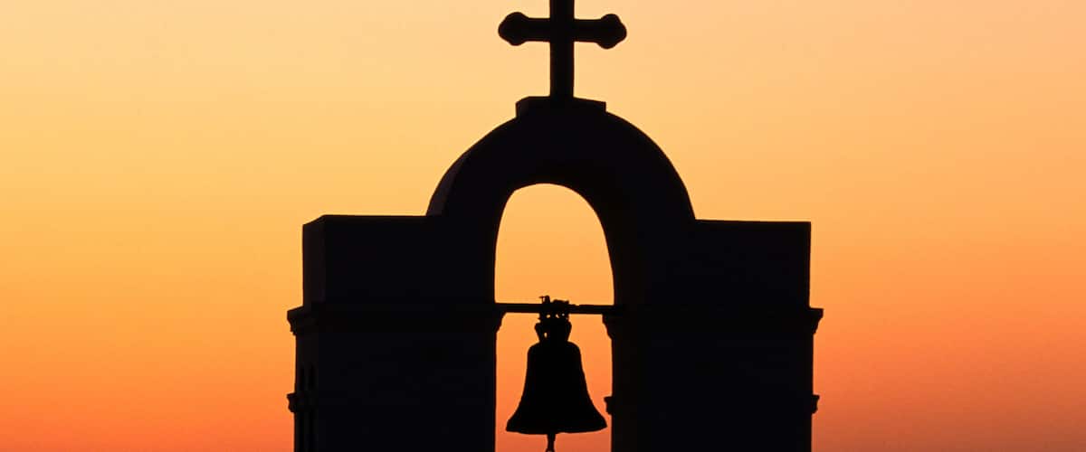 Church Bells at Sunset in Santorini, Greece