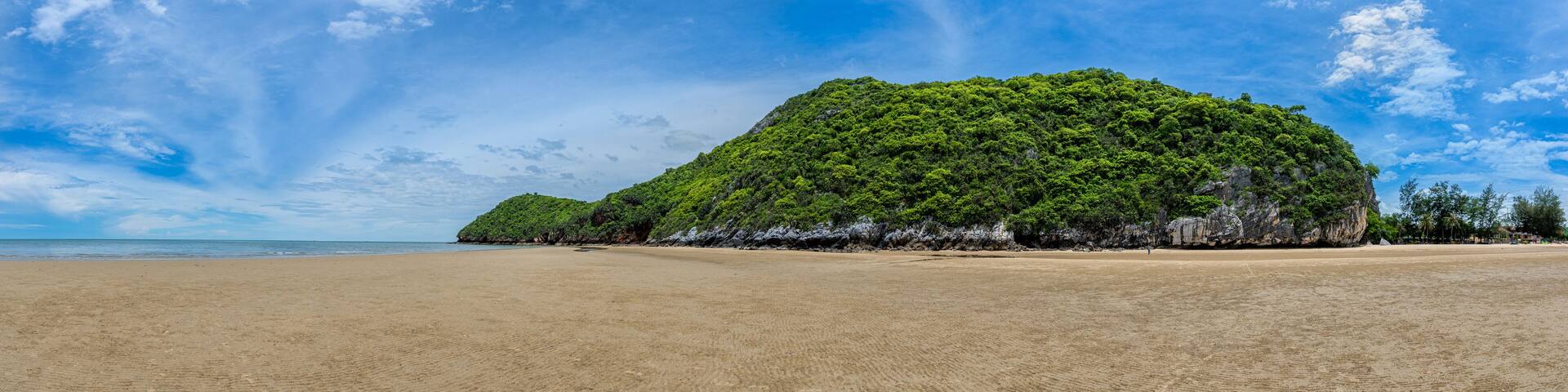 Prachuap Khiri Khan Thailand-May 16,2022 Khao Kalok Beach, Panorama image,Sandy beach and Mountain view by the sea a beautiful sky A tourist attraction that is quite like a vacation, Khao Kalok Beach