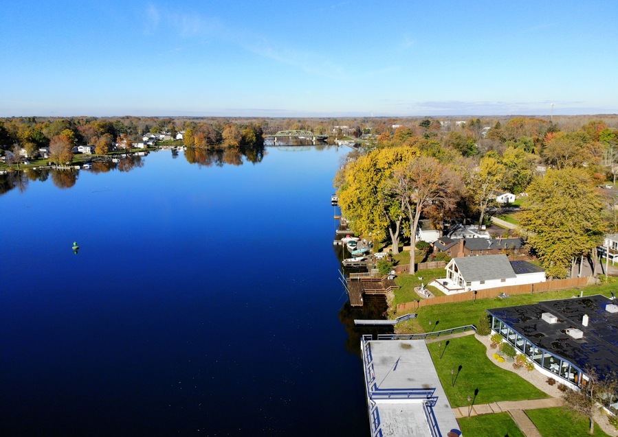 The aerial view of the waterfront homes by Oneida Lake with stunning fall foliage near Syracuse, New York, U.S.A