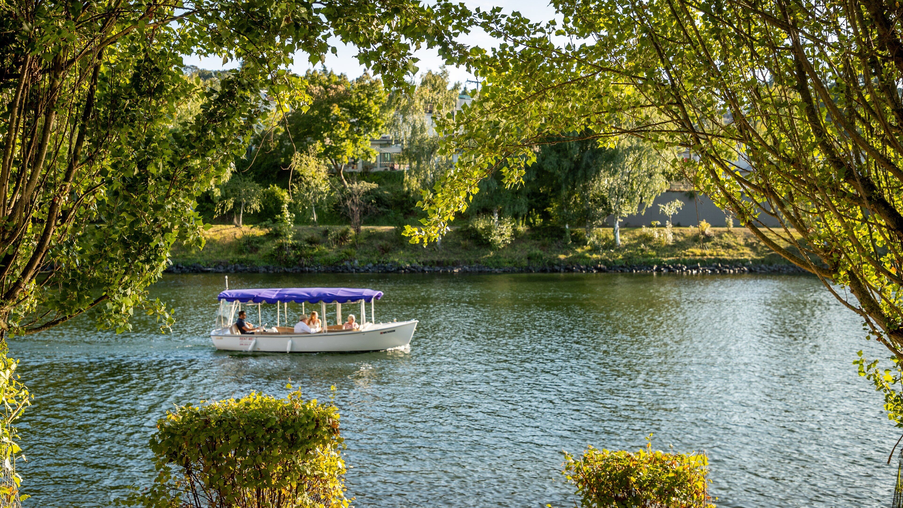 Lake Union featuring boating and a lake or waterhole as well as a small group of people
