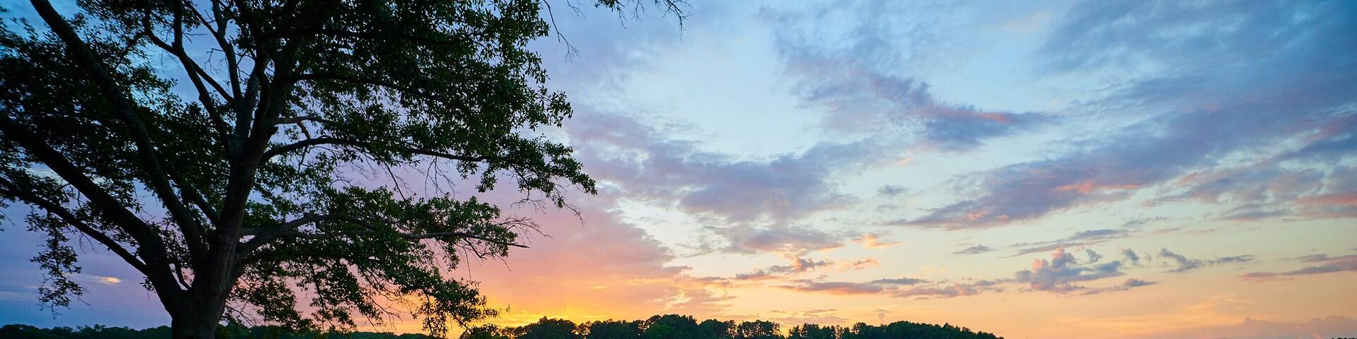Female Kayaker on Lake Keowee at Sunset