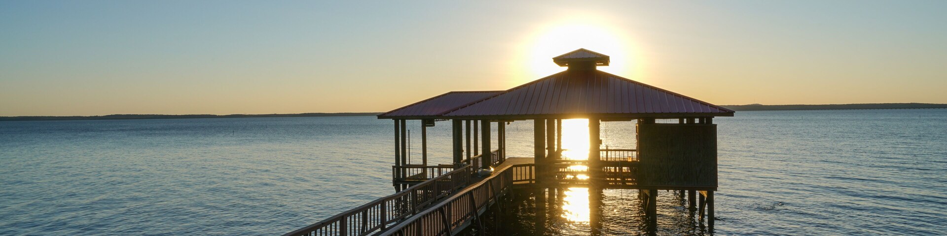 Boat dock on Toledo Bend Reservoir, Louisiana, during sunset