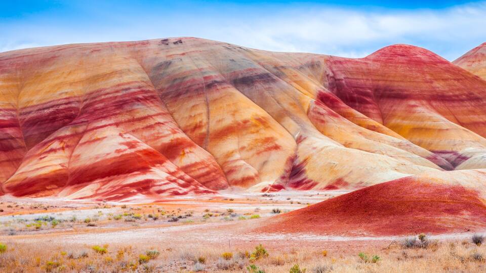 A colorful geological formation with layered rock strata.