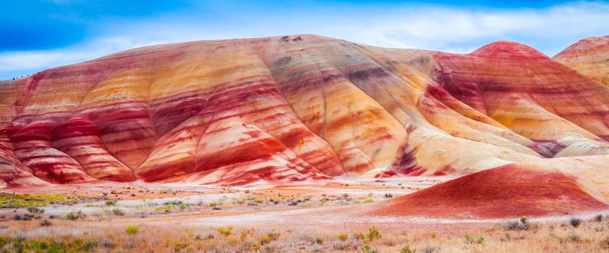 A colorful geological formation with layered rock strata.
