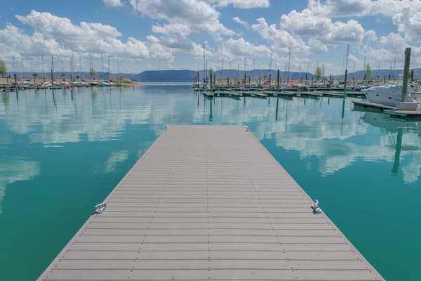 Bear Lake straddles both Utah and Idaho, and has been described as the "Caribbean of the Rockies" for its intensely turquoise blue water. The gorgeous color is a result of the reflection of limestone deposits that are suspended in the lake. #bearlake #utah #idaho #lake #blue #turqoise