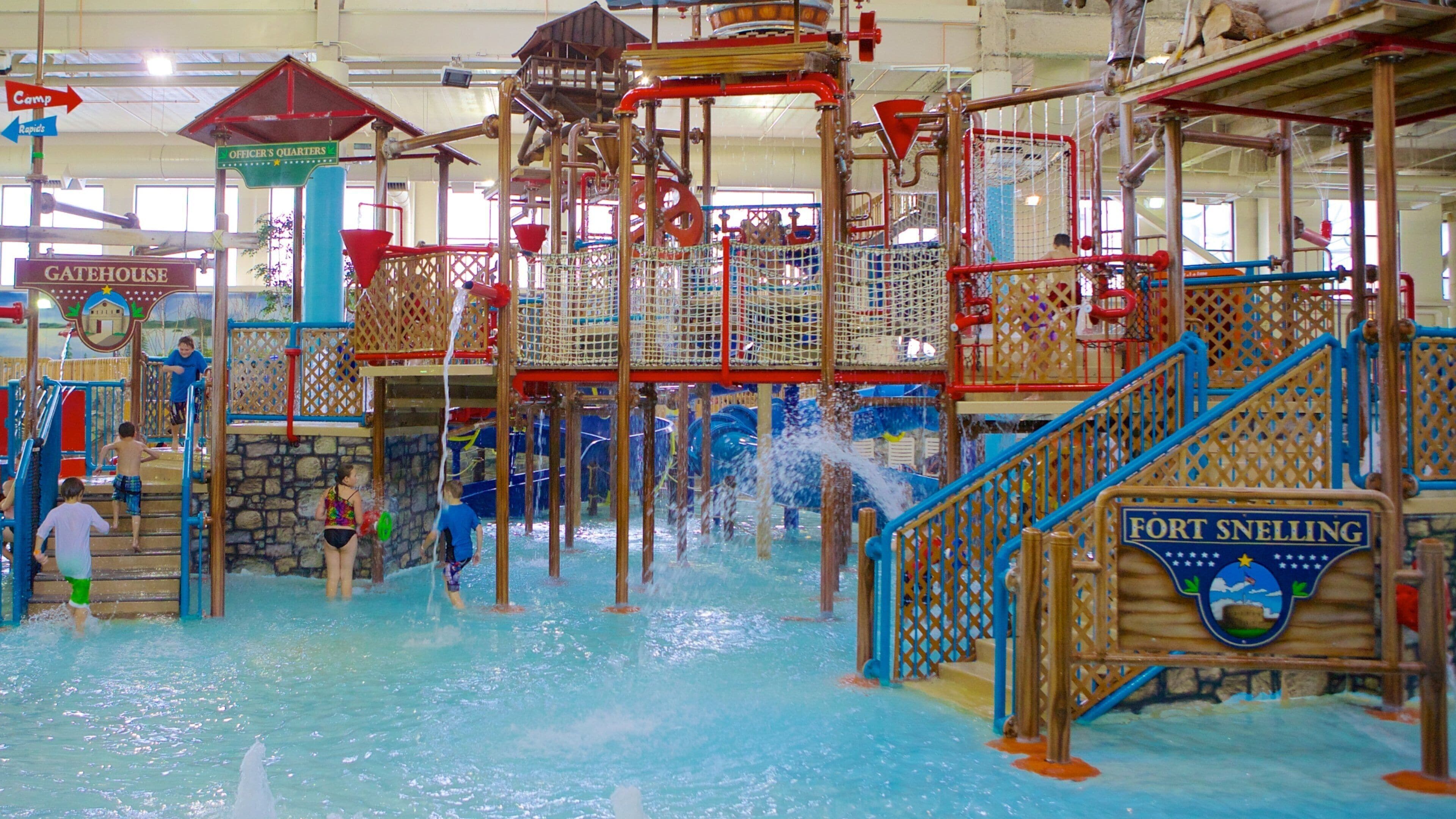 A water park with various play structures and water features.