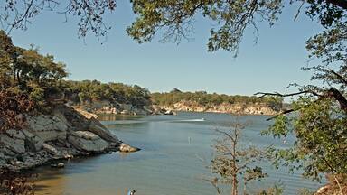 View of Lake Texoma at Eisenhower State Park outside Denison Texas and a man putting on his life vest to go kayaking.; Shutterstock ID 46891936; Purchase Order: -