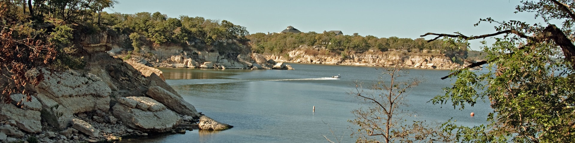 View of Lake Texoma at Eisenhower State Park outside Denison Texas and a man putting on his life vest to go kayaking.; Shutterstock ID 46891936; Purchase Order: -