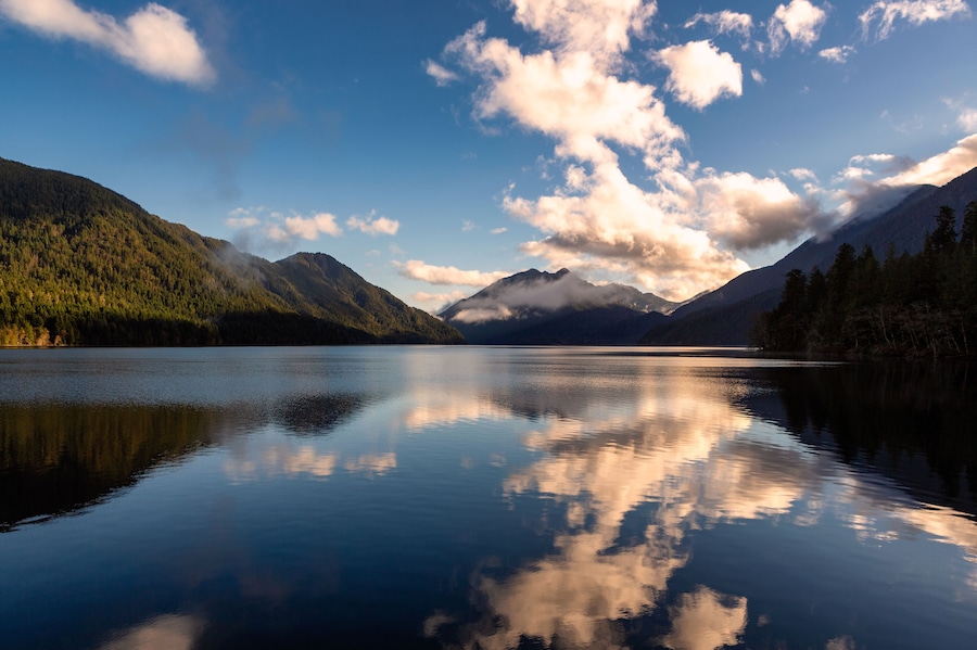 Clouds and Mountains reflect off a lake in Olympic National Park, Washington