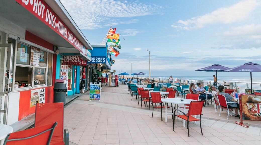 Daytona Beach Boardwalk showing outdoor eating and a coastal town