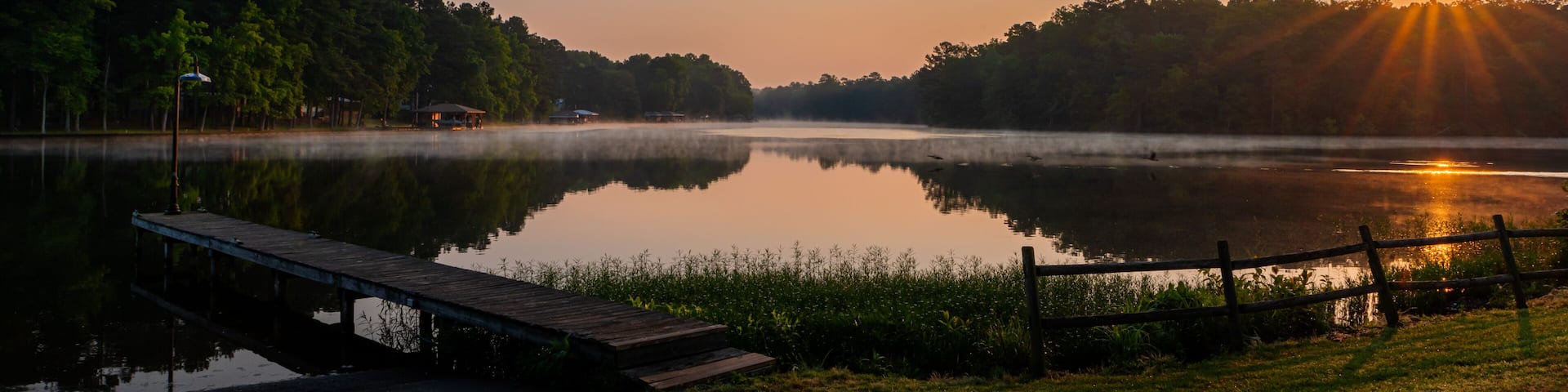 Sunrise on Lake Gaston sunburst and reflection on the water