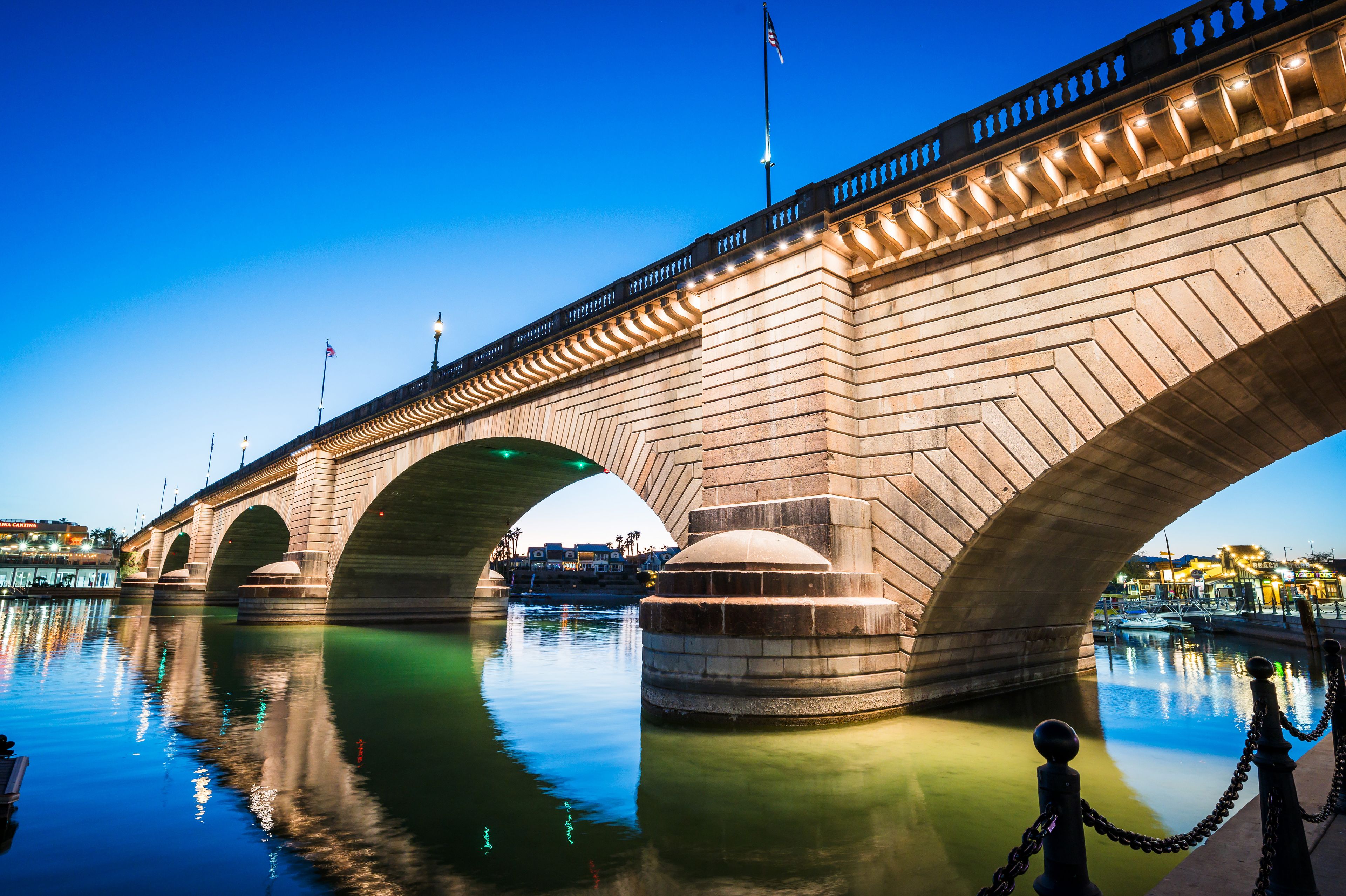 Tourists near the old London Bridge at sunset, which was relocated from London England in the 1970’s to Lake Havasu Arizona.