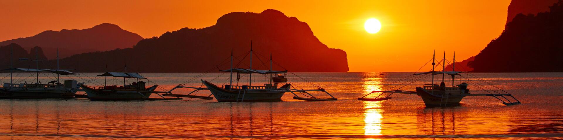 Traditional filippino boats at El Nido bay in sunset lights. Palawan island, Philippines; Shutterstock ID 432201058; Purchase Order: -