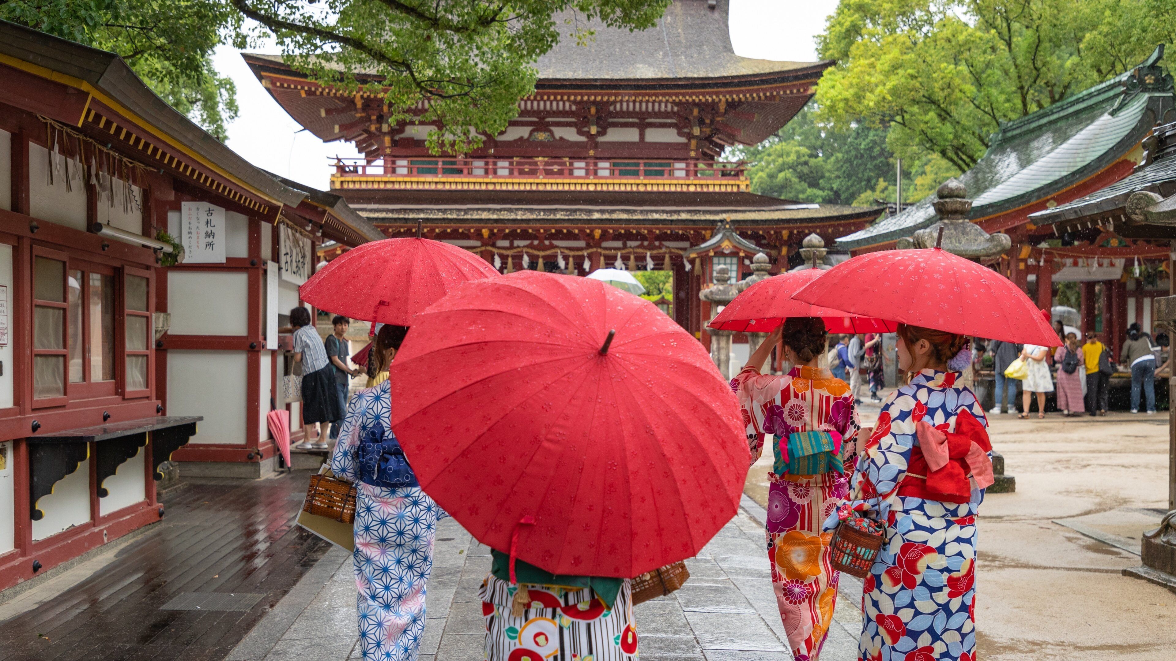 Kyushu and Okinawa featuring street scenes as well as a small group of people