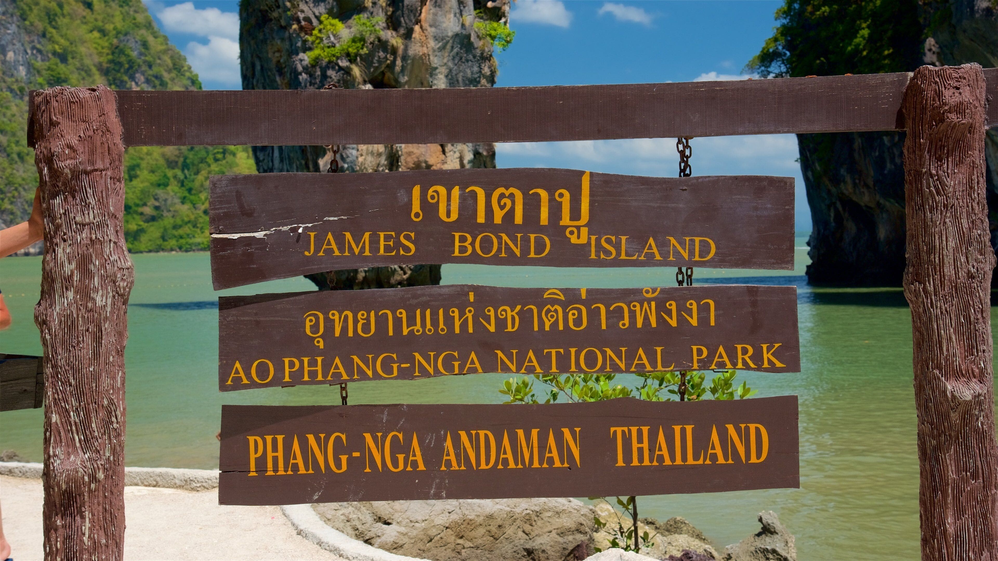 Khao Phing Kan featuring general coastal views, tropical scenes and signage