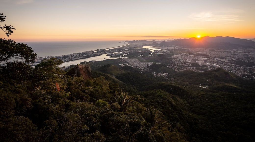 Beautiful view to the sunset and the city from rainforest mountain