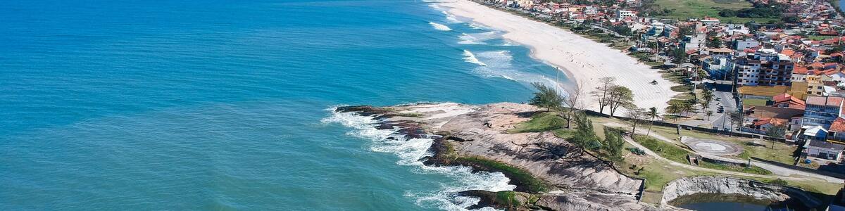 Aerial view of Saquarema and Itaúna beach in Rio de Janeiro. Famous for the waves and the church on top of the hill. Sunny day. drone photo.
