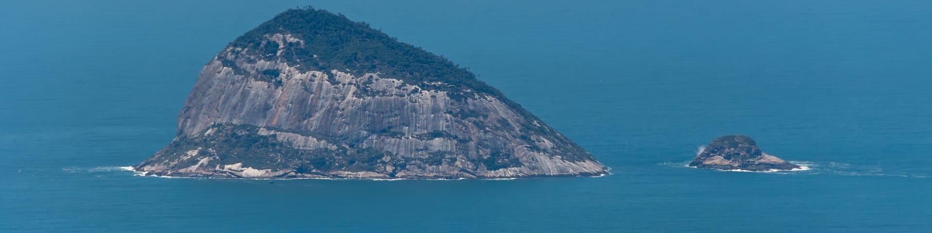 Wide view of Ilha Redonda from the Pedra Bonita viewpoint, a paradise in Rio de Janeiro, Brazil.