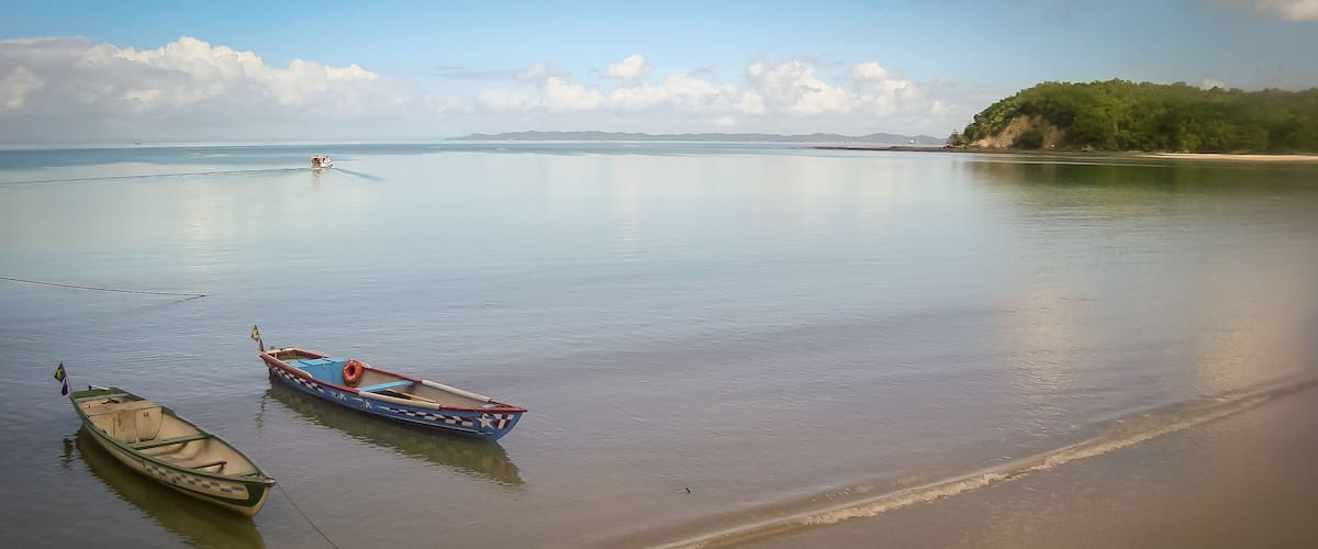 Amazing landscape, isolated boat in the sea, in Ilha de Mare, Salvador, Brazil