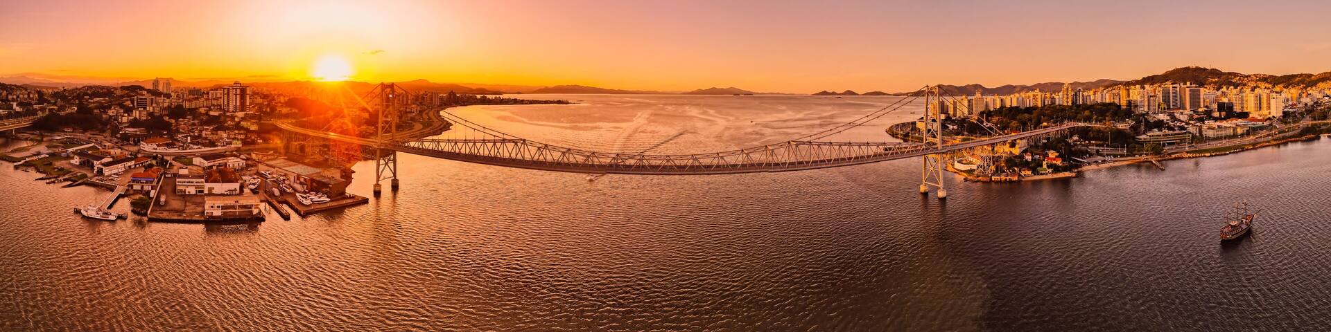 Panoramic view of Hercilio luz cable bridge with sunset light in Florianopolis, Brazil