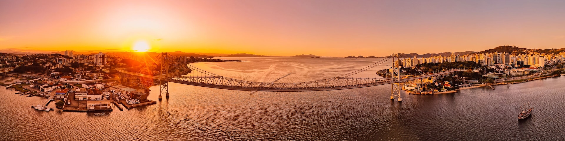 Panoramic view of Hercilio luz cable bridge with sunset light in Florianopolis, Brazil
