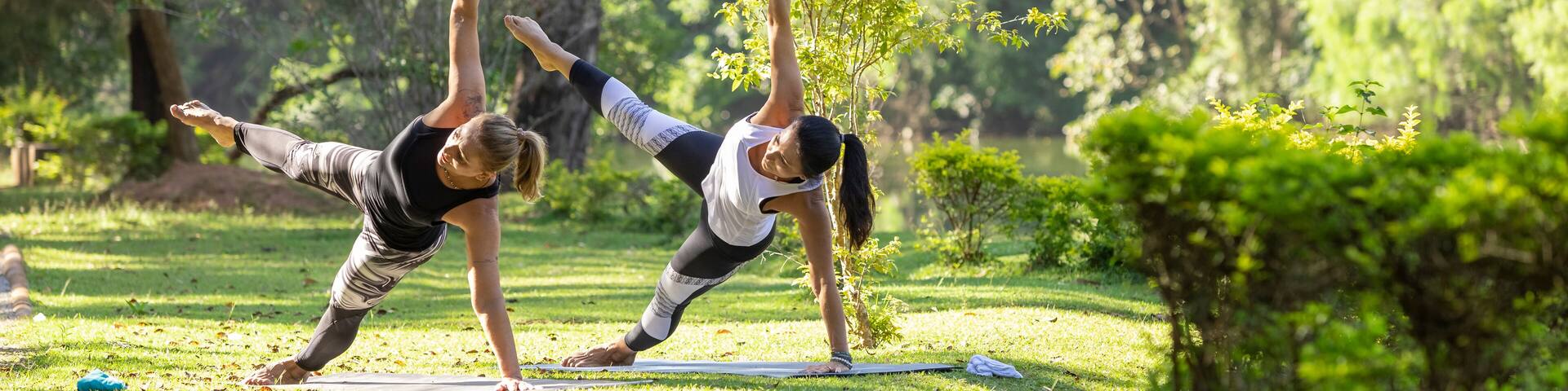 two women practicing yoga in a park, Barueri, São Paulo, Brazil