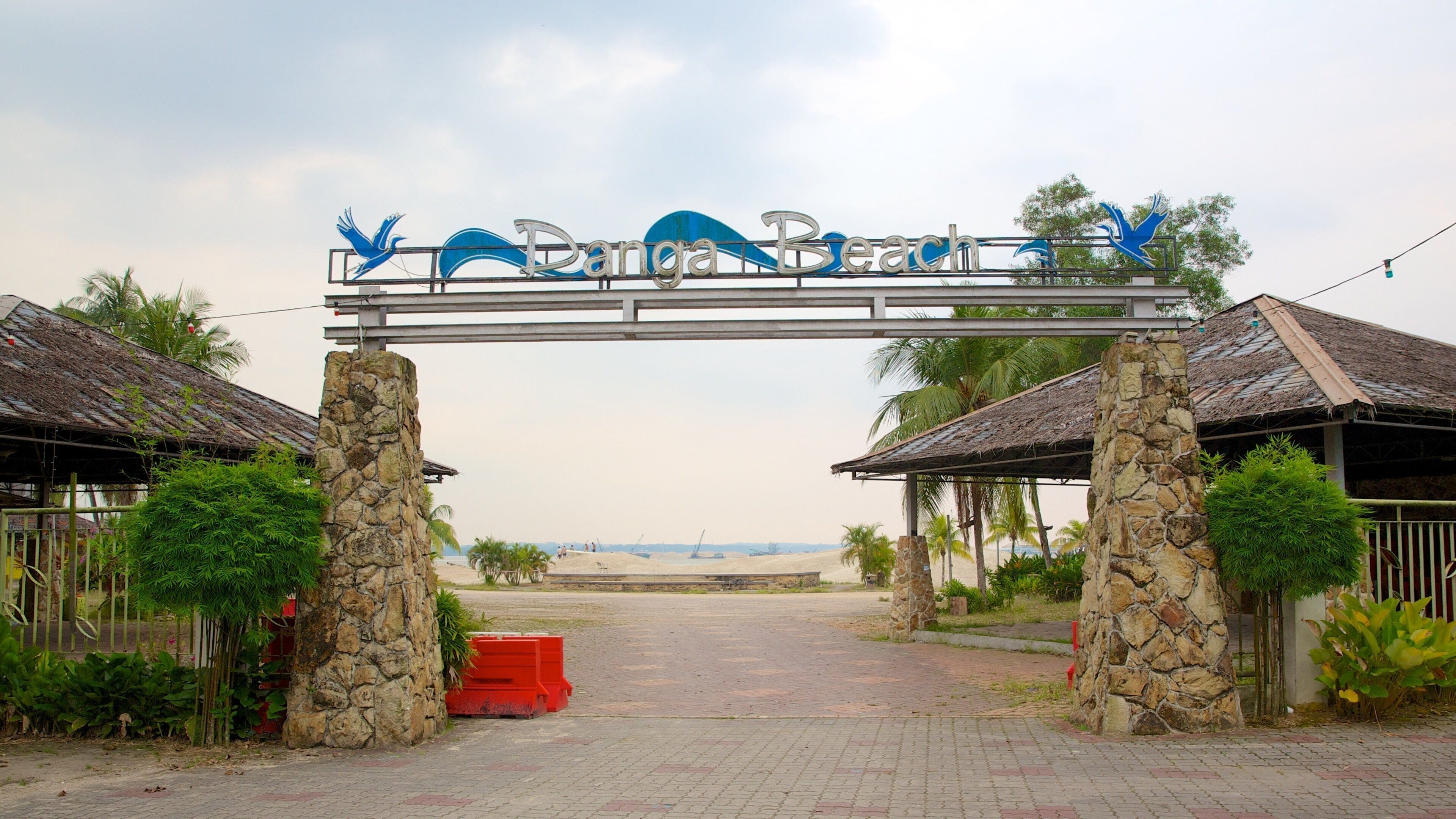 Danga Bay featuring signage and a sunset