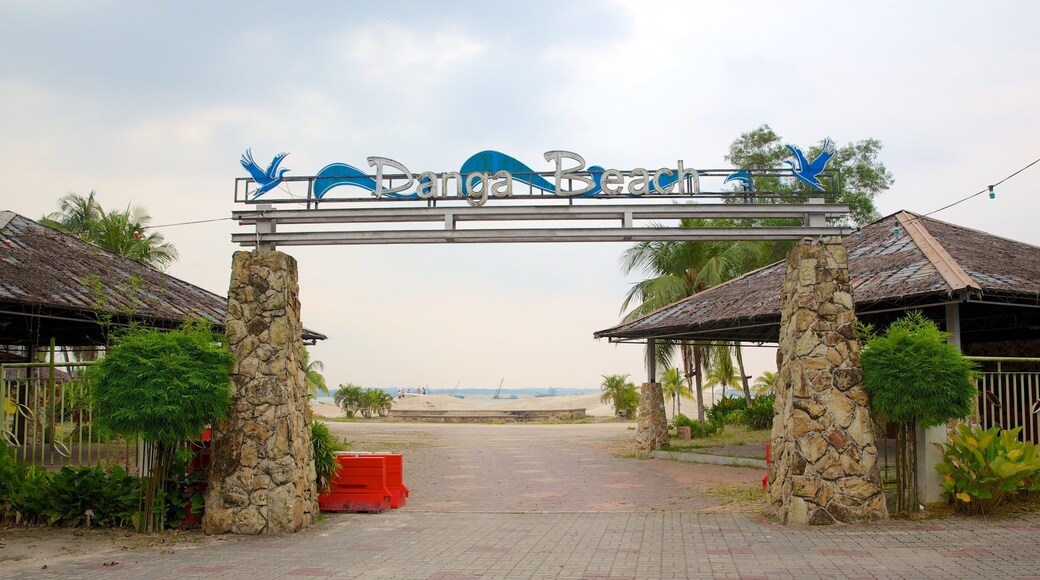 Danga Bay featuring signage and a sunset