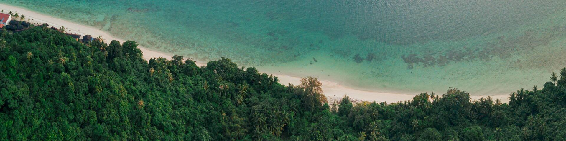 Aerial drone view of seascape scenery with at Tinggi Island or Pulau Tinggi in Mersing, Johor, Malaysia