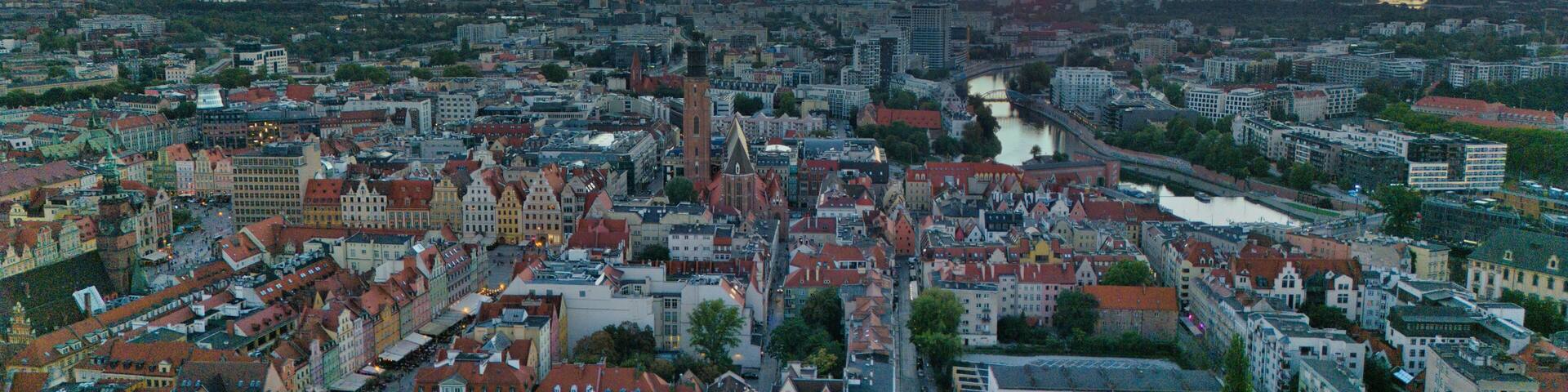 Golden Hour Aerial Panorama of Wrocław Old Town with Market Square, Historic Tenement Houses and Gothic Architecture in the Heart of Poland