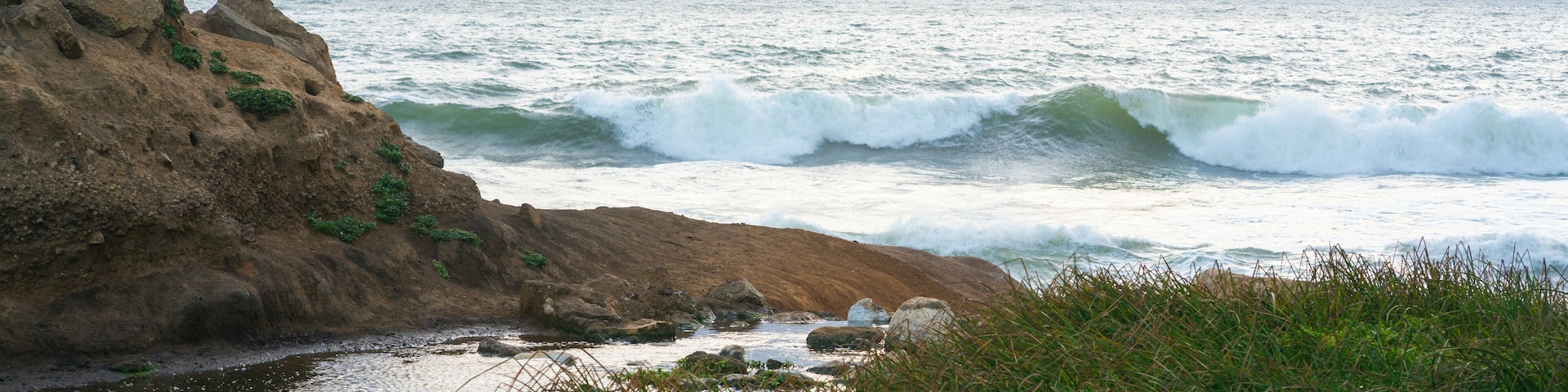 Rockaway Beach, located in the small coastal city of Pacifica, San Francisco Bay Area, California. The beach is used for fishing and leisure. It has many hiking trails around.