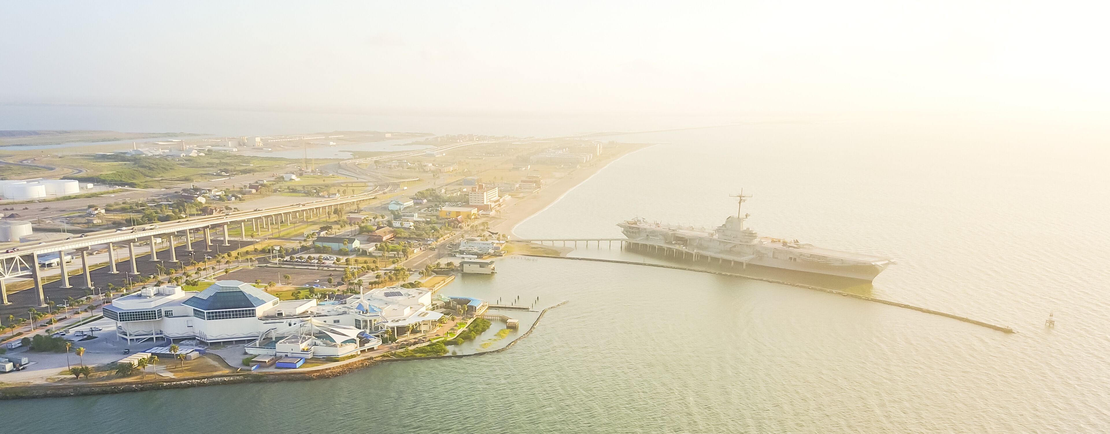 Panorama aerial view North Beach in Corpus Christi, Texas, USA with aircraft carrier ship