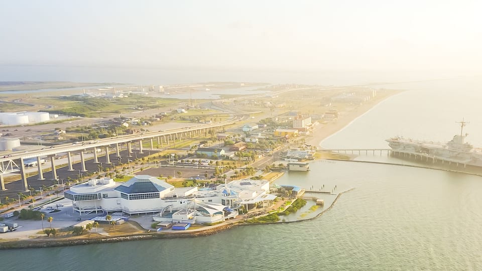 Panorama aerial view North Beach in Corpus Christi, Texas, USA with aircraft carrier ship