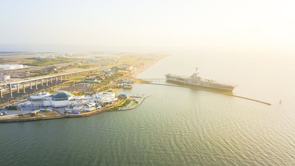Aerial view North Beach in Corpus Christi, Texas, USA with aircraft carrier ship