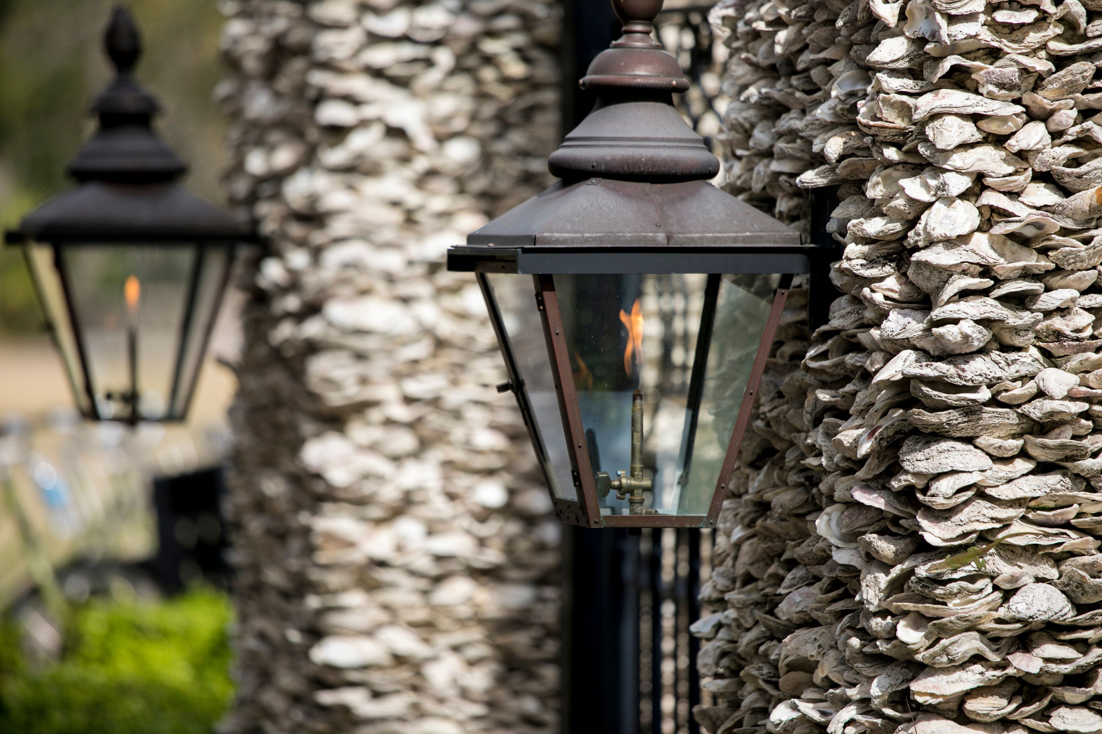 Architectural detail of gas lamps on oyster shell wall in South Carolina.