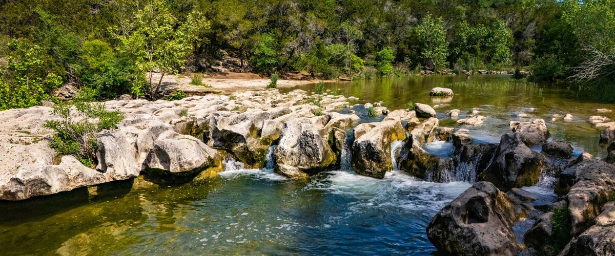 Scenic aerial view of Sculpture Falls via Barton Creek Greenbelt Trail