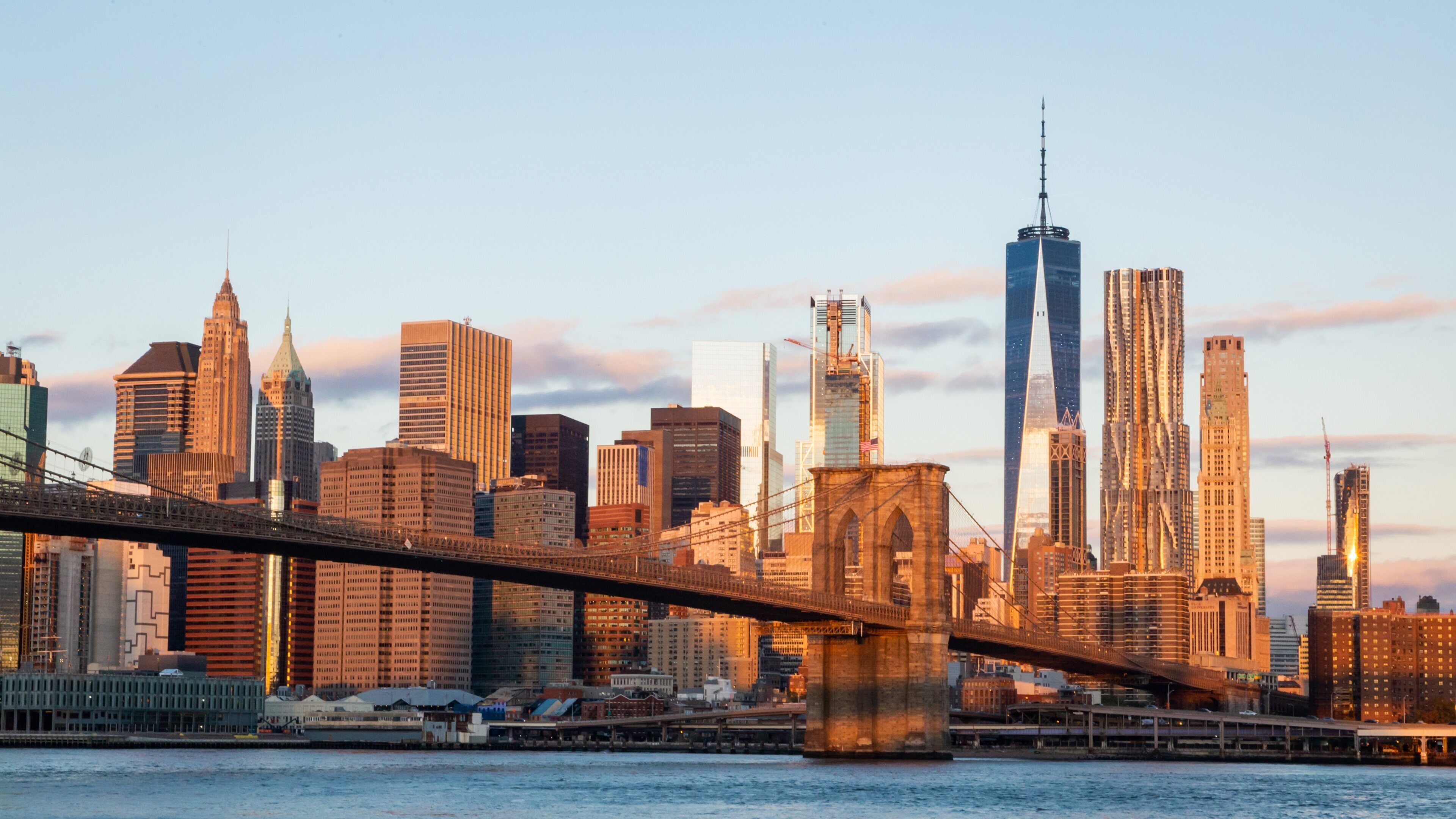 Dumbo featuring a sunset, a city and a bay or harbor