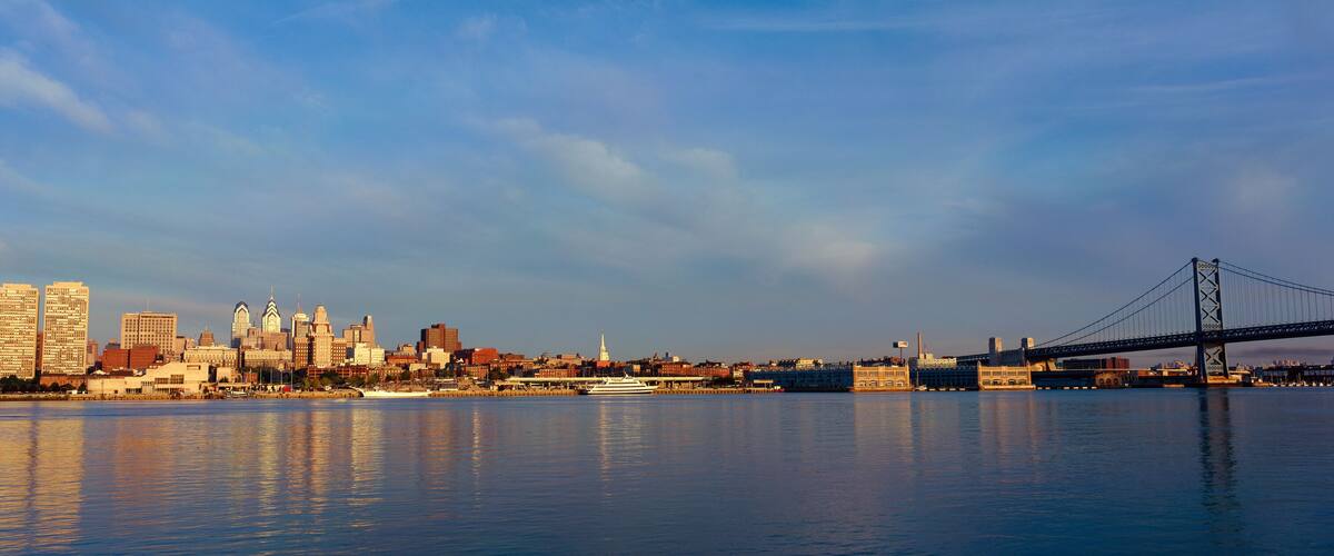 Panoramic view of Delaware River as seen from Camden New Jersey of Philadelphia, PA at sunrise