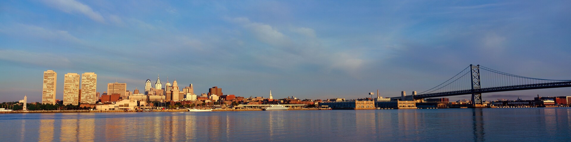 Panoramic view of Delaware River as seen from Camden New Jersey of Philadelphia, PA at sunrise