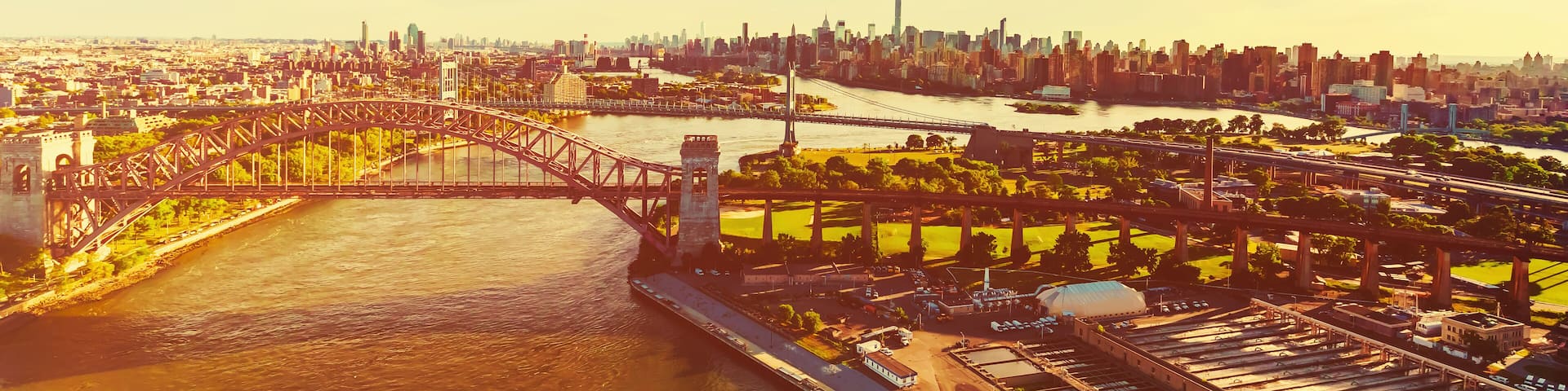 Aerial view of the Hell Gate Bridge over the East River in NY