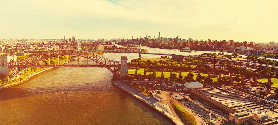 Aerial view of the Hell Gate Bridge over the East River in NY