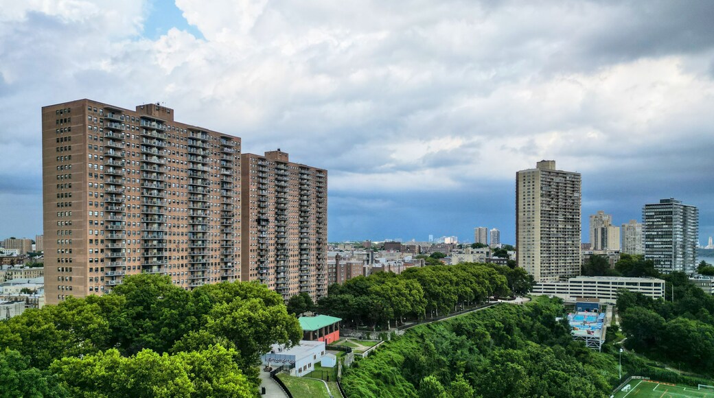 tall apartment buildings with balconies overlooking manhattan new york (west weehawken jersey city hoboken) ny nj housing real estate residential tower living rent skyline