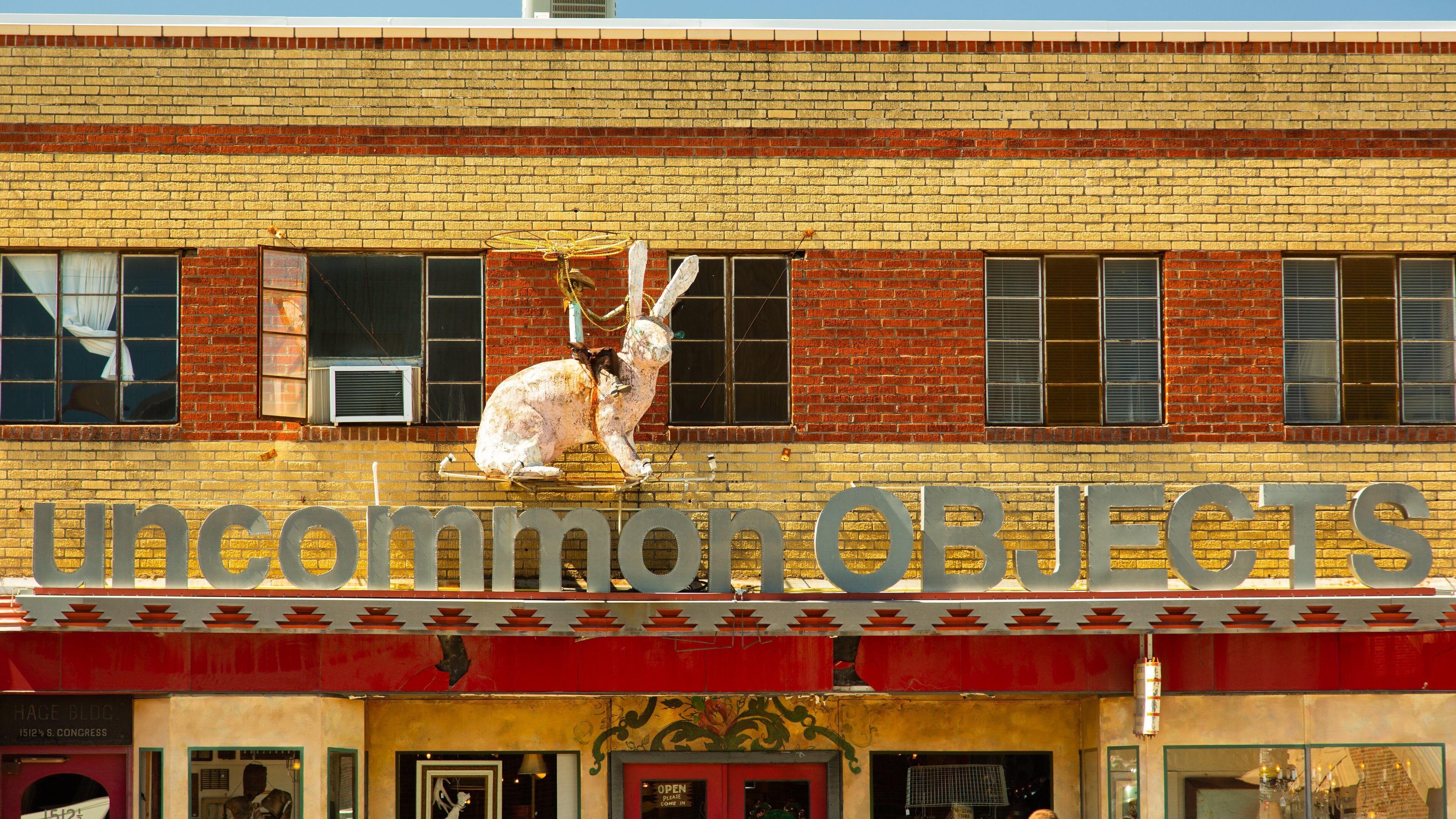 South Congress featuring outdoor art and signage