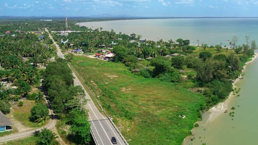 Panoramic aerial drone view of river estuary and seascape in Sedili Kecil, Johor, Malaysia