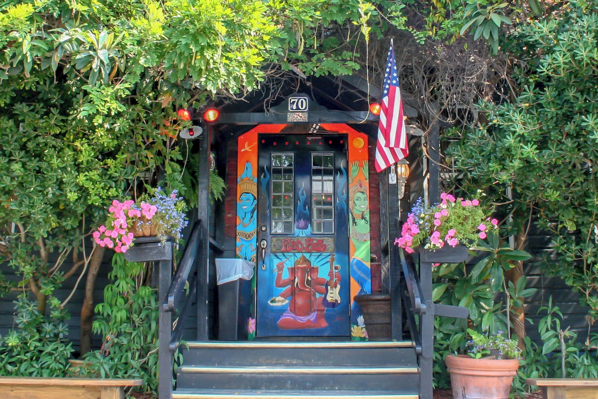 The door to the famous Red Bar in Grayton Beach FL. An old building in a funky little community on the FL panhandle, the Red Bar is a local institution. The walls are covered in old posters and kitschy art, the booth seats are held together with duct tape, the light is dark - but the food is delicious and the live music is always rocking. You can hardly get in here in the summer when the tourists are in town, but in the off season this a favorite locals hangout. #localgem #graytonbeach #30a