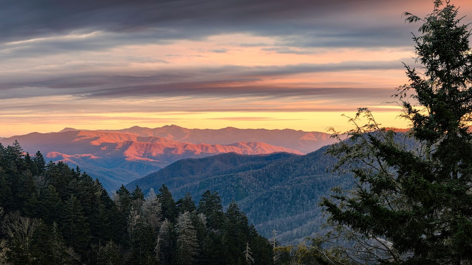 A mountain range with a sunset sky.