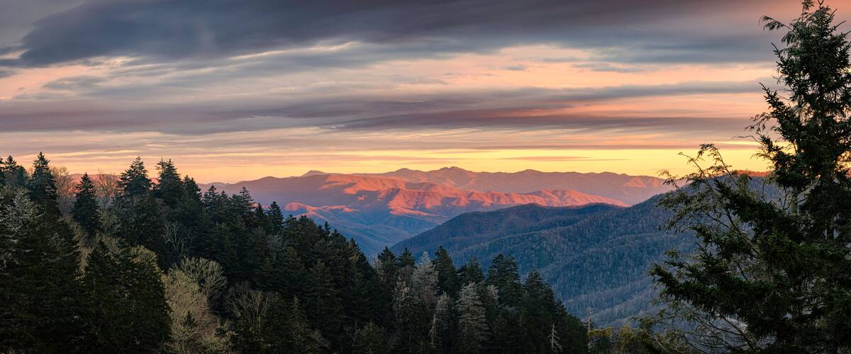 A mountain range with a sunset sky.