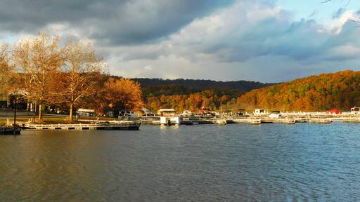 Lake view of boat marina in autumn. Image taken at Seven Springs, Raystown Lake Region, Pennsylvania. The Appalachian Mountains are seen in the background. ; Shutterstock ID 1269373534; Purchase Ord