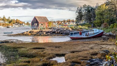 Fishing boats, old and new, a lobster shack, and scattered trap floats fill the harbor scene at Mackerel Cove on Bailey Island at the tip of the rocky Harpswell Peninsula of Down East Maine.